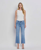 HIGH RISE UNEVEN RAW HEM KICK FLARE JEANS