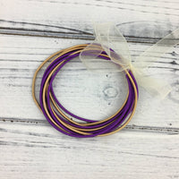 Purple and gold guitar string bracelet